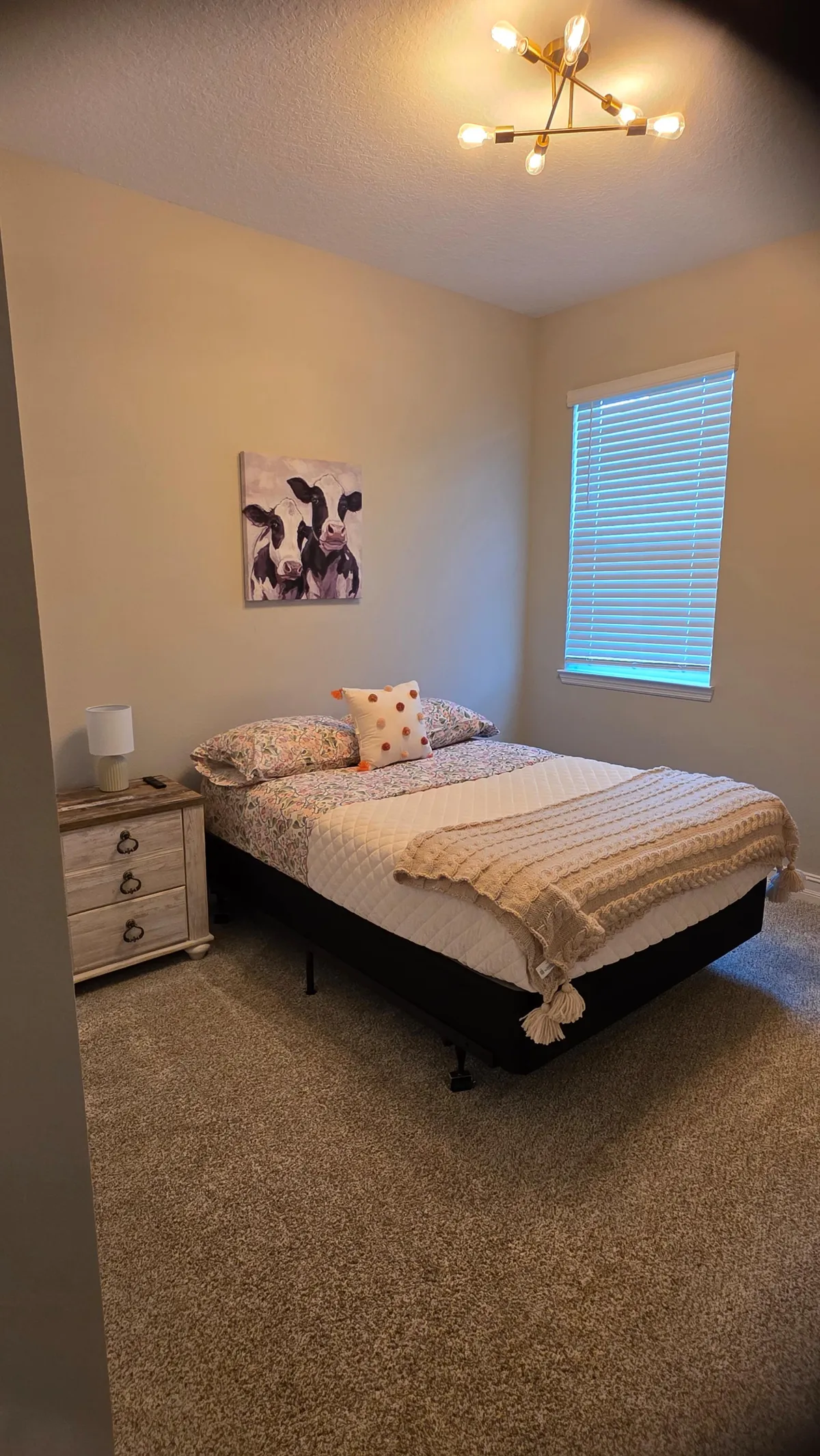 Guest room with styled quilt after cleaning in Ocala