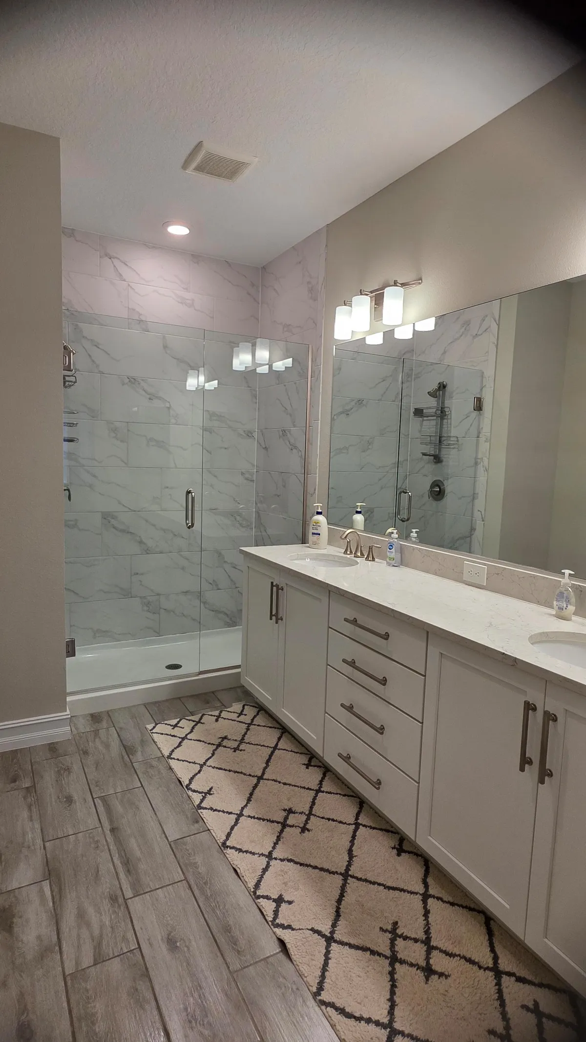 Master bathroom with marble shower after cleaning